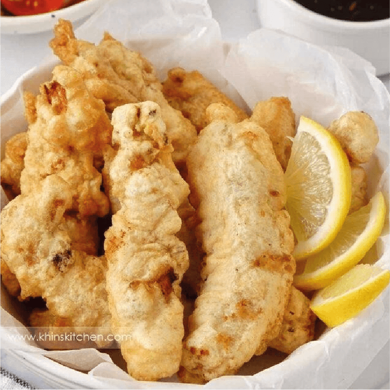 Chicken tempura with lemon and ketchup